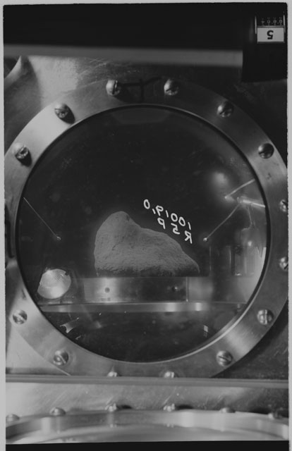 Black and white photograph of apollo 11 Sample(s) 10019,0; Processing photograph displaying sample in vacuum vault at R5P .