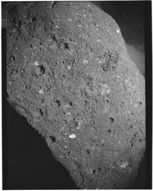 Black and white photograph of Apollo 11 Sample(s) 10019; Processing photograph displaying a close up of surface.