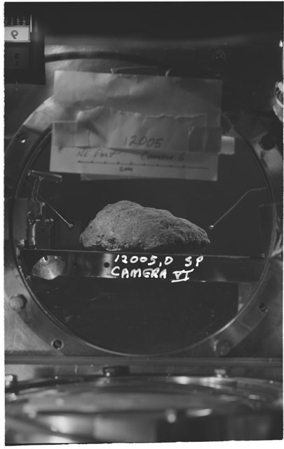 Black and white photograph of Apollo 12 Sample(S) 12005,0; Processing photograph displaying the sample using Camera VI.