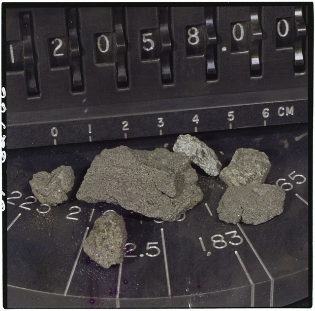 Color photograph of Apollo 12 Sample(S) 12052,58; Processing photograph displaying the sample renamed from 12058.