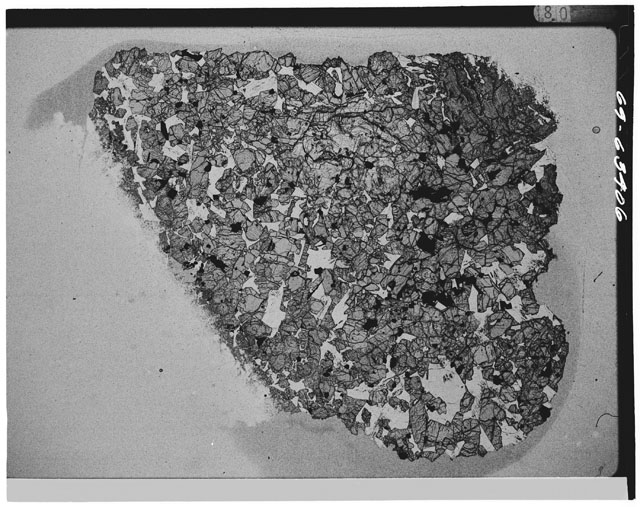 Black and white Thin Section photograph of Apollo 12 Sample(s) 12057,20 using cross nichols light.
