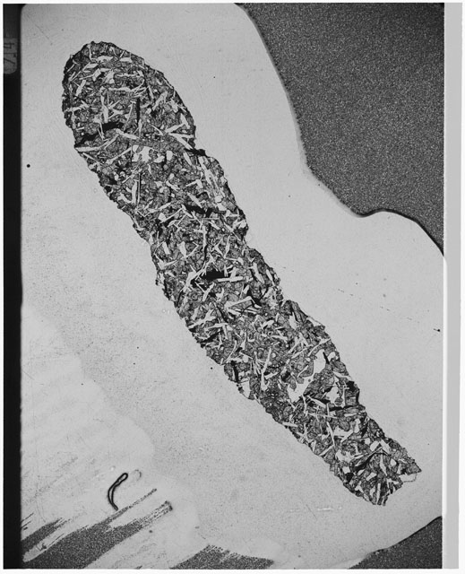 Black and white Thin Section photograph of Apollo 12 Sample(s) 12057,39 using cross nichols light.
