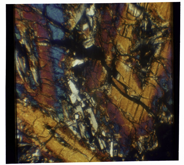 Color mosaic Thin Section photograph of Apollo 12 Sample(s) 12065,7 using cross nichols light.