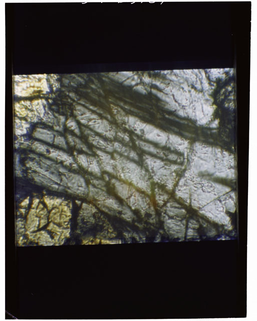 Color Thin Section photograph of Apollo 12 Sample(s) 12057,14 using cross nichols light.