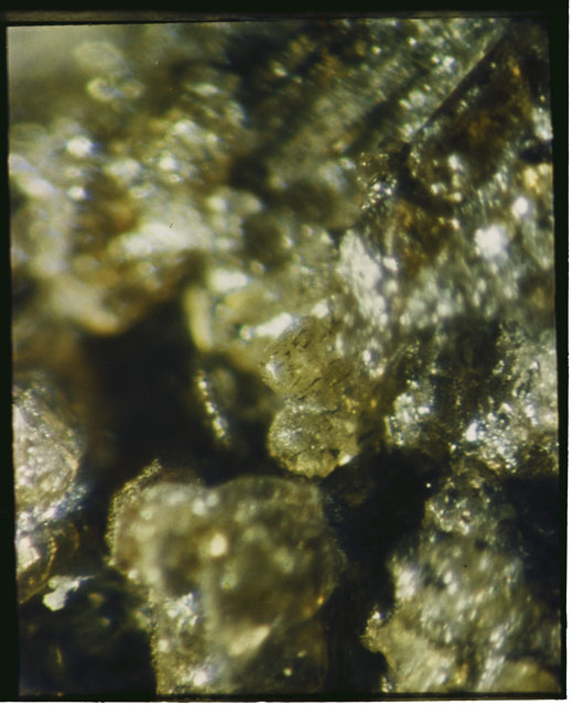 Color photograph of Apollo 12 sample 12075; Processing photograph displaying a close up of the clast.