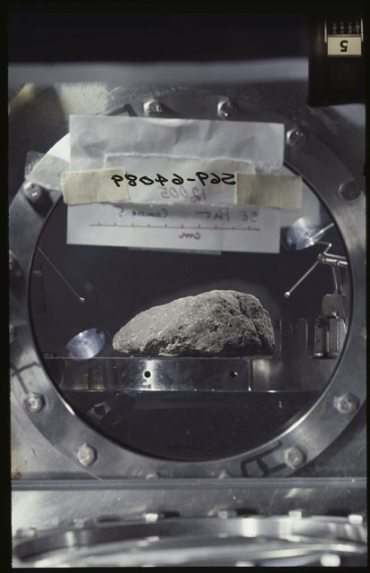 Color photograph of Apollo 12 Sample(S) 12005,0; Processing photograph displaying the sample using Camera V.