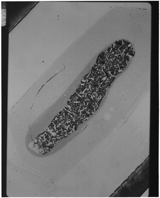 Black and white Thin Section photograph of Apollo 12 Sample(s) 12057,24 using cross nichols light.
