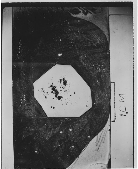 Black and white photograph of Apollo 12 sample 12044,35; Thin Section photograph displaying grain mount.