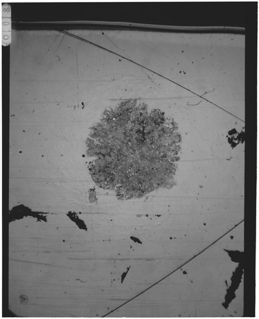 Black and white Thin Section photograph of Apollo 12 sample 12001,111 displaying grain mount.