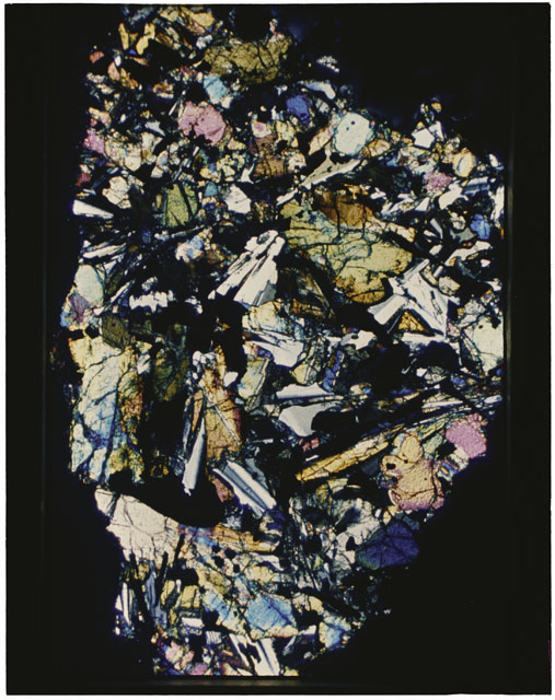 Color photograph of Apollo 12 sample 12001,108; Thin Section photograph displaying grain mount.