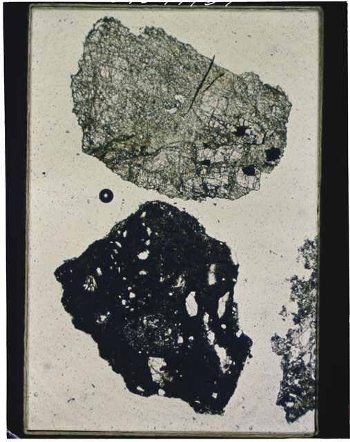 Color photograph of Apollo 12 sample 12001,105; Thin Section photograph displaying grain mount.