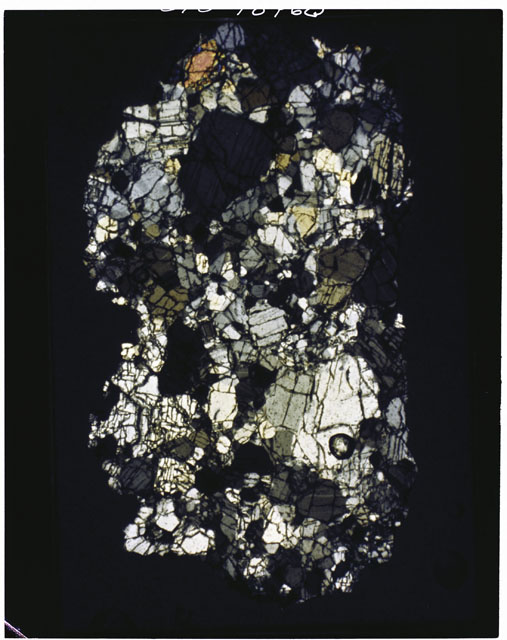 Color photograph of Apollo 11 Sample(s) 10085,78; Thin Section photograph using cross nichols light.