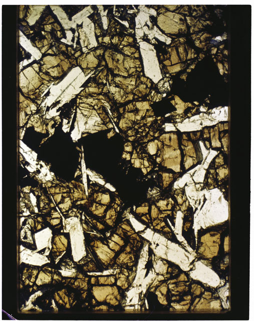 Color photograph of Apollo 11 Sample(s) 10085,75; Thin Section photograph using cross nichols light.