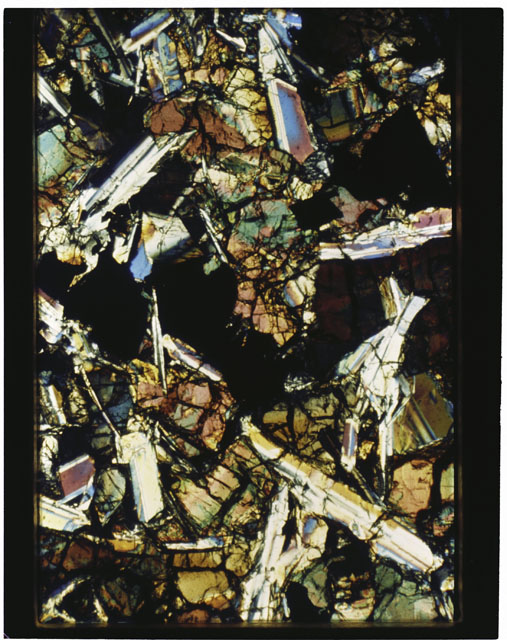 Color photograph of Apollo 11 Sample(s) 10085,75; Thin Section photograph using cross nichols light.