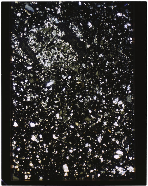 Color photograph of Apollo 11 Sample(s) 10085,77; Thin Section photograph using cross nichols light.