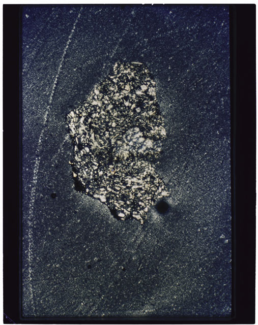 Color photograph of Apollo 11 Sample(s) 10085,71; Thin Section photograph using cross nichols light.