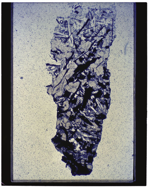 Color photograph of Apollo 11 Sample(s) 10085,66; Thin Section photograph using cross nichols light.