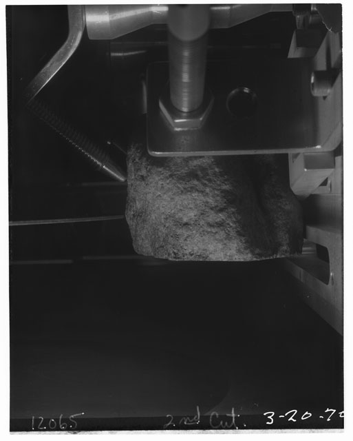 Black and white photograph of Apollo 12 Sample(S) 12065; Processing photograph displaying cutting slab.