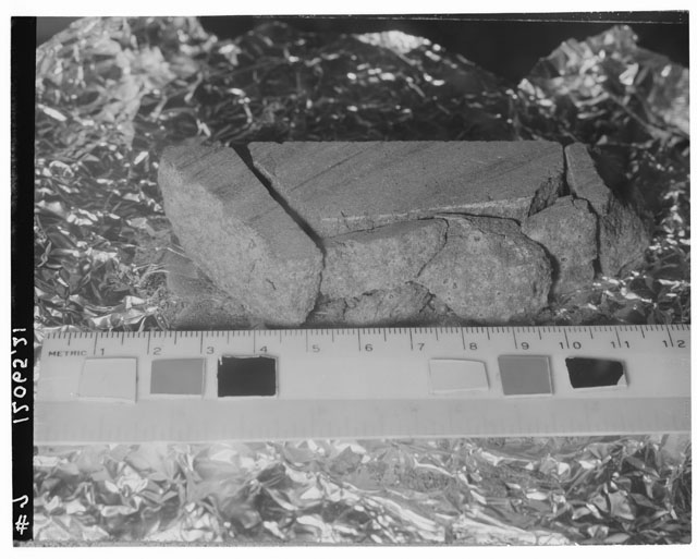 Black and white photograph of Apollo 12 Sample(S) 12065; Processing photograph displaying slab reconstruction.