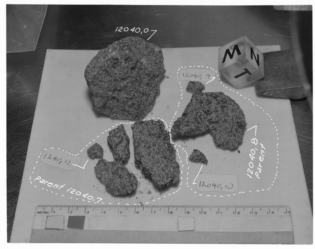 Black and white photograph of Apollo 12 Sample(S) 12040,7,8-11; Processing photograph displaying a post chip sample with an orientation of N,W,T.