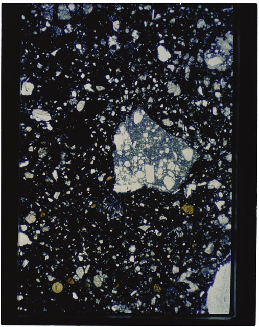 Color photograph of Apollo 11 Sample(s) 10021; Thin Section B using transmitted light.