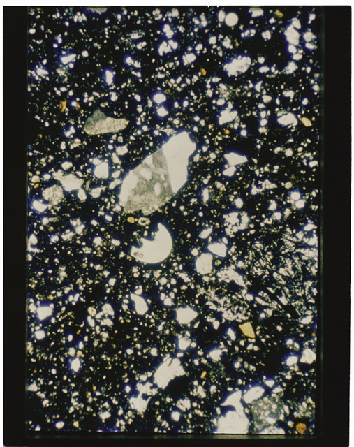 Color photograph of Apollo 11 Sample(s) 10021; Thin Section B using cross nichols light.