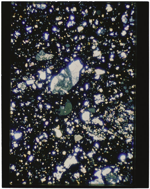 Color photograph of Apollo 11 Sample(s) 10021; Thin Section B using cross nichols light.