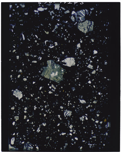 Color photograph of Apollo 11 Sample(s) 10021; Thin Section B using transmitted light.