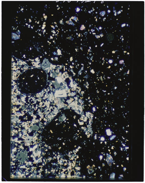 Color photograph of Apollo 11 Sample(s) 10046; Thin Section G photograph using cross nichols light.