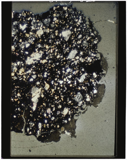 Color photograph of Apollo 11 Sample(s) 10085,96; Thin Section photograph using cross nichols light.