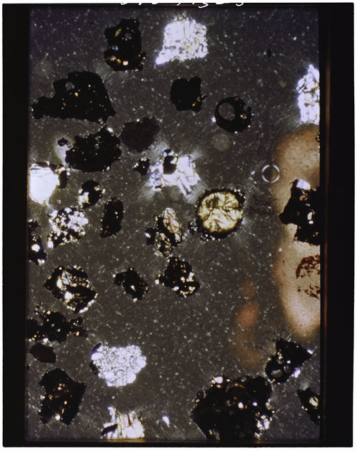 Color photograph of Apollo 11 Sample(s) 10085,91; Thin Section photograph using cross nichols light.
