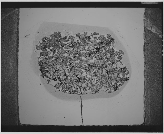 Black and white Thin Section photograph of Apollo 12 Sample(s) 12057,42 using cross nichols light.