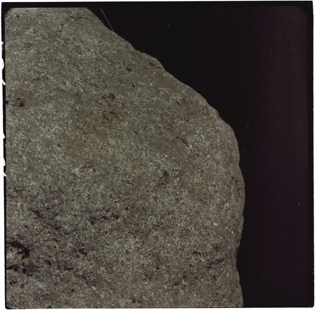 Black and white photograph of Apollo 12 sample 12051; Processing photograph displaying a close up of the surface.