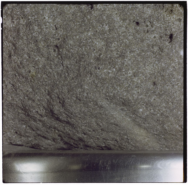Black and white photograph of Apollo 12 sample 12051; Processing photograph displaying a close up of the surface.