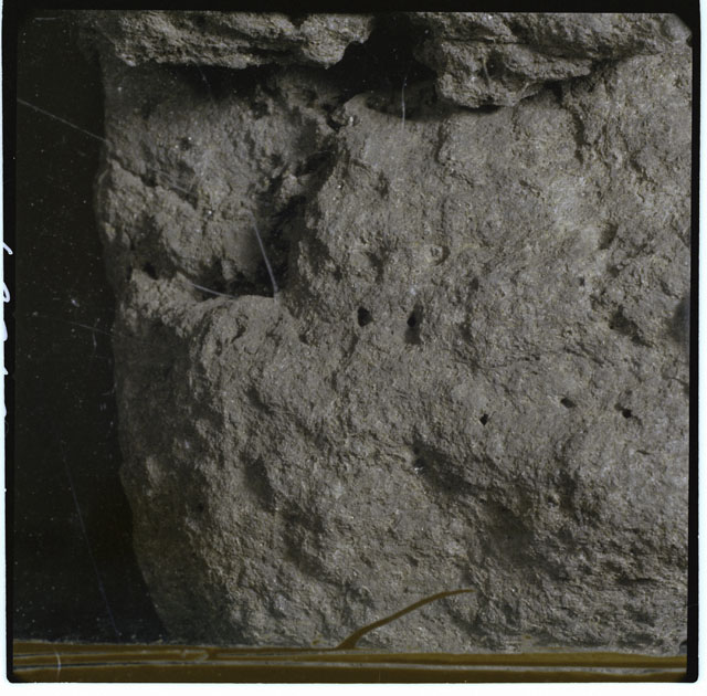Black and white photograph of Apollo 12 sample 12052; Processing photograph displaying a close up of the surface.
