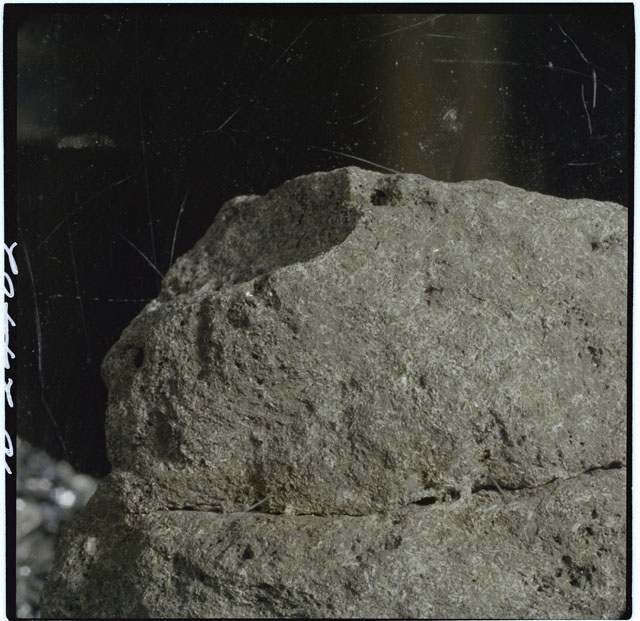 Black and white photograph of Apollo 12 sample 12052; Processing photograph displaying a close up of the surface.