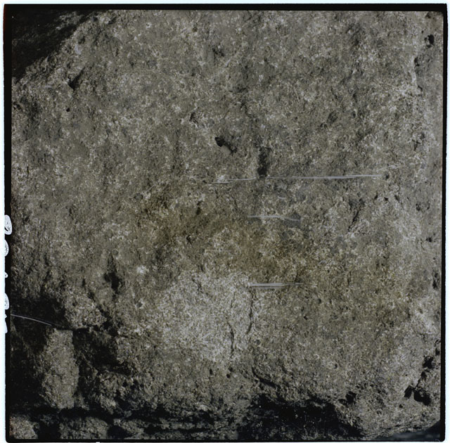 Color photograph of Apollo 12 sample 12063; Processing mosaic photograph displaying a close up of the surface.