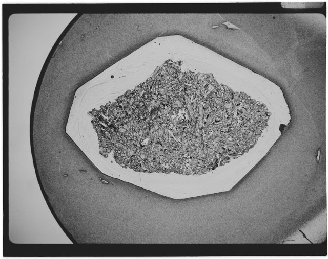 Black and white Thin Section photograph of Apollo 12 Sample(s) 12018,10 using cross nichols light.