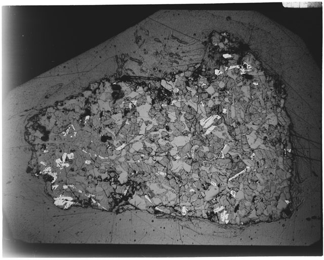 Black and white Thin Section photograph of Apollo 12 Sample(s) 12064,6 using cross nichols light.
