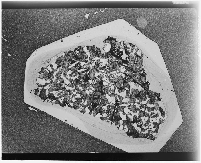 Black and white Thin Section photograph of Apollo 12 Sample(s) 12064,8 using cross nichols light.
