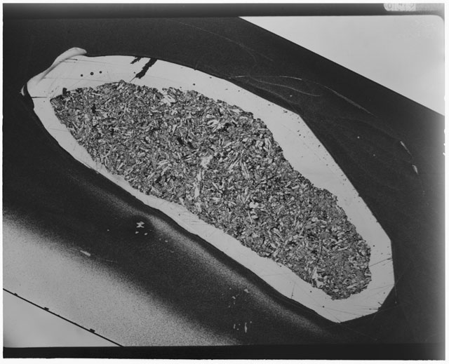 Black and white Thin Section photograph of Apollo 12 Sample(s) 12063,18 using cross nichols light.