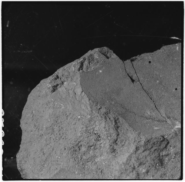 Black and white photograph of Apollo 12 sample 12009; Processing mosaic photograph displaying a close up of the surface.