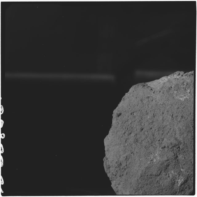 Black and white photograph of Apollo 12 sample 12034,0; Processing mosaic photograph displaying a close up of the surface.