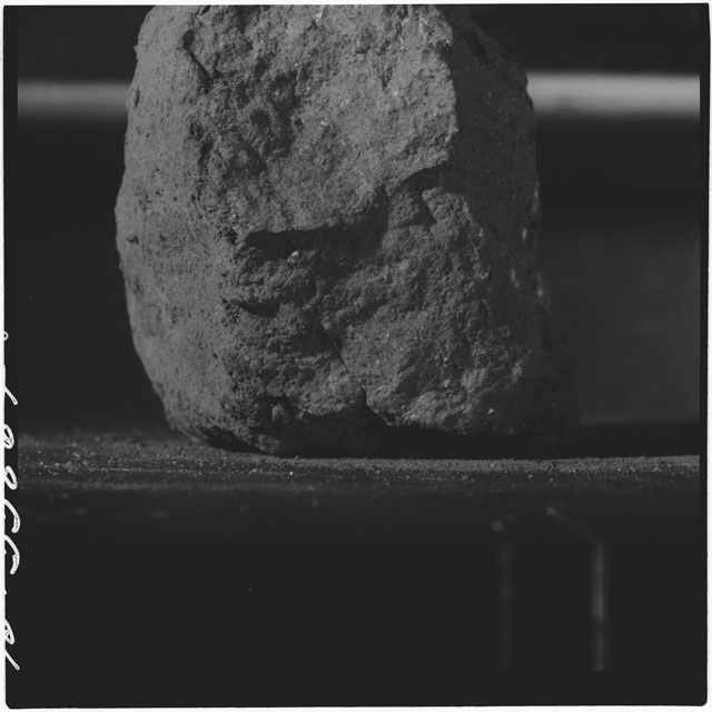 Black and white photograph of Apollo 12 sample 12034,0; Processing mosaic photograph displaying a close up of the surface.