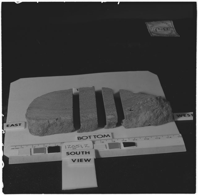 Black and white photograph of Apollo 12 Sample(S) 12051,2; Processing photograph displaying a post cut sample with an orientation of .