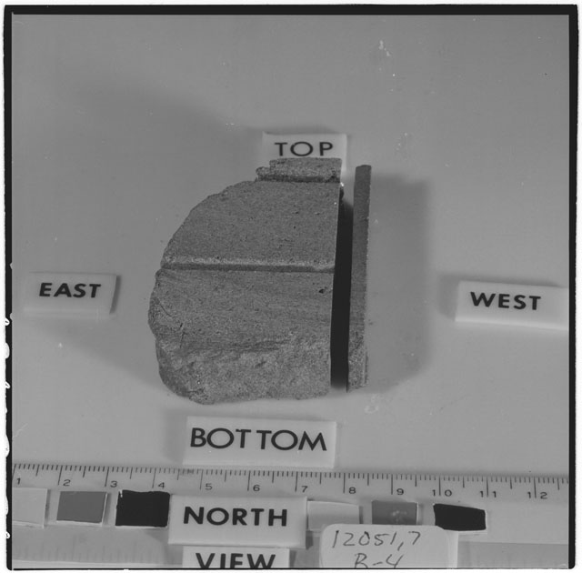 Black and white photograph of Apollo 12 Sample(S) 12051,7,27-30; Processing photograph displaying a reconstruction sample with an orientation of .