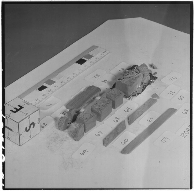 Black and white photograph of Apollo 12 Sample(S) 12065,59-71,73-76; Processing photograph displaying a slab reconstruction sample with an orientation of E,S.