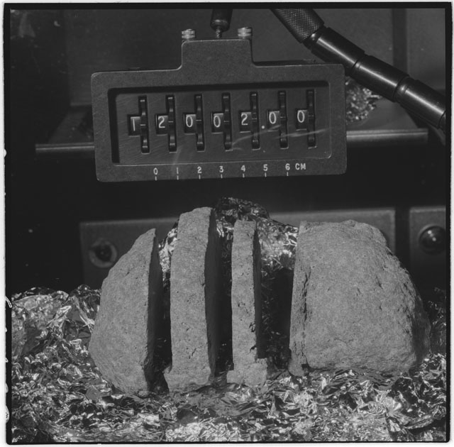 Black and white photograph of Apollo 12 Sample(S) 12002,0; Processing photograph displaying post slab.