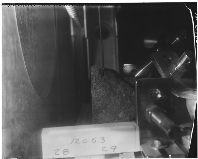 Black and white photograph of Apollo 12 Sample(S) 12063; Processing photograph displaying cutting.
