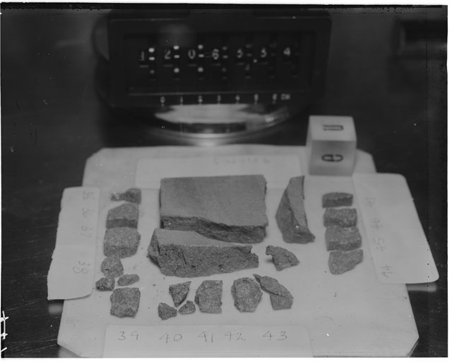 Black and white photograph of Apollo 12 Sample(S) 12063,35-48; Processing photograph displaying a post chip group with an orientation of N,E .